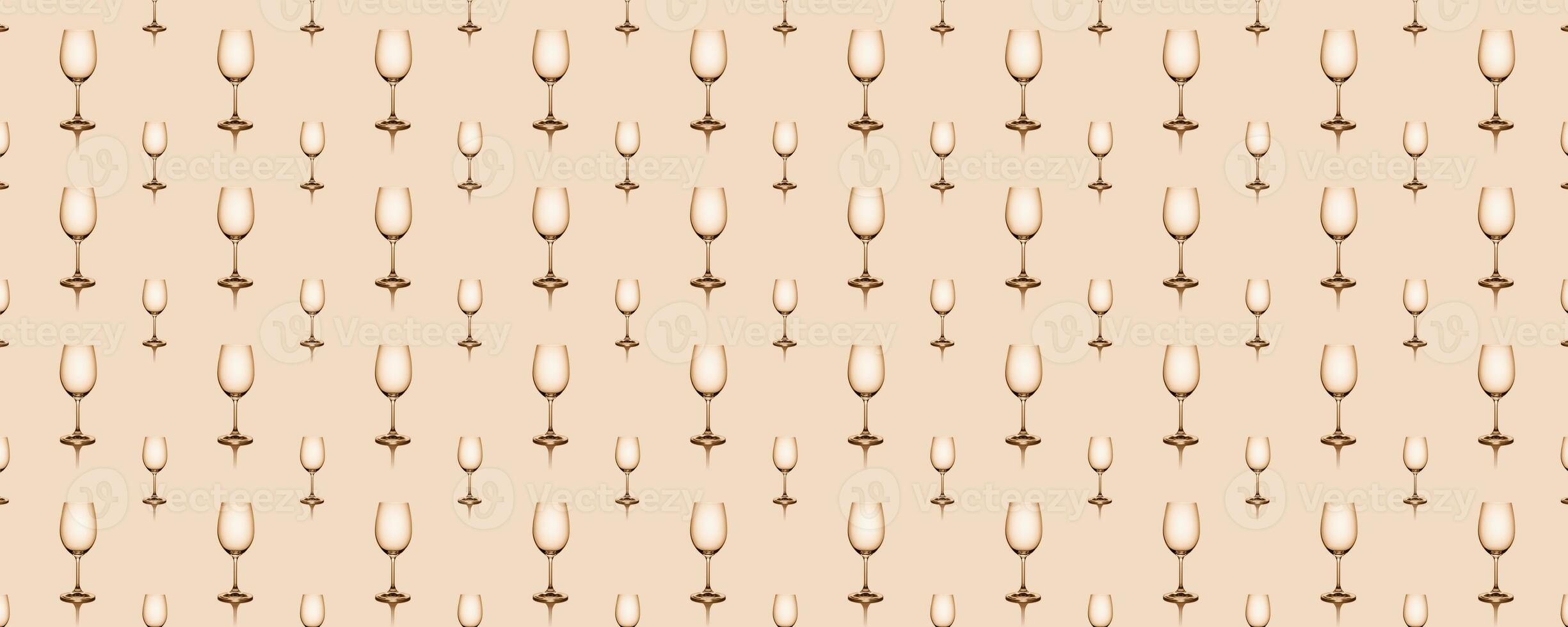 Seamless pattern of empty wine glasses on beige background. photo