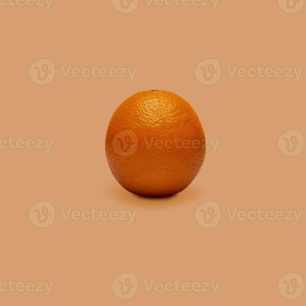 Orange fruit isolated on orange background. The concept of the benefits of citrus fruits. photo