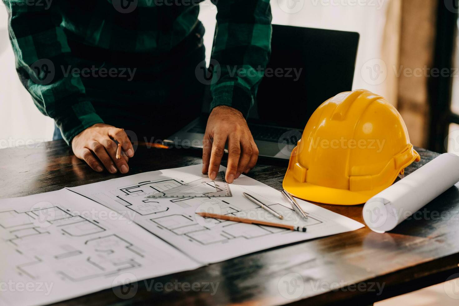 Construction and structure concept of engineer working drawing on blueprint meeting for project working with partner on model building and engineering tools in working site, construction concept. photo