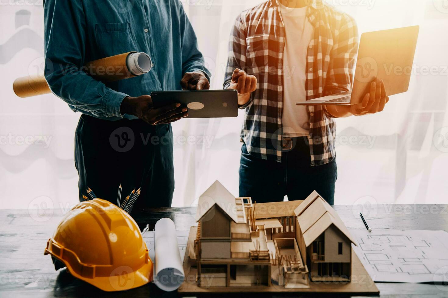 Construction and structure concept of engineer working drawing on blueprint meeting for project working with partner on model building and engineering tools in working site, construction concept. photo