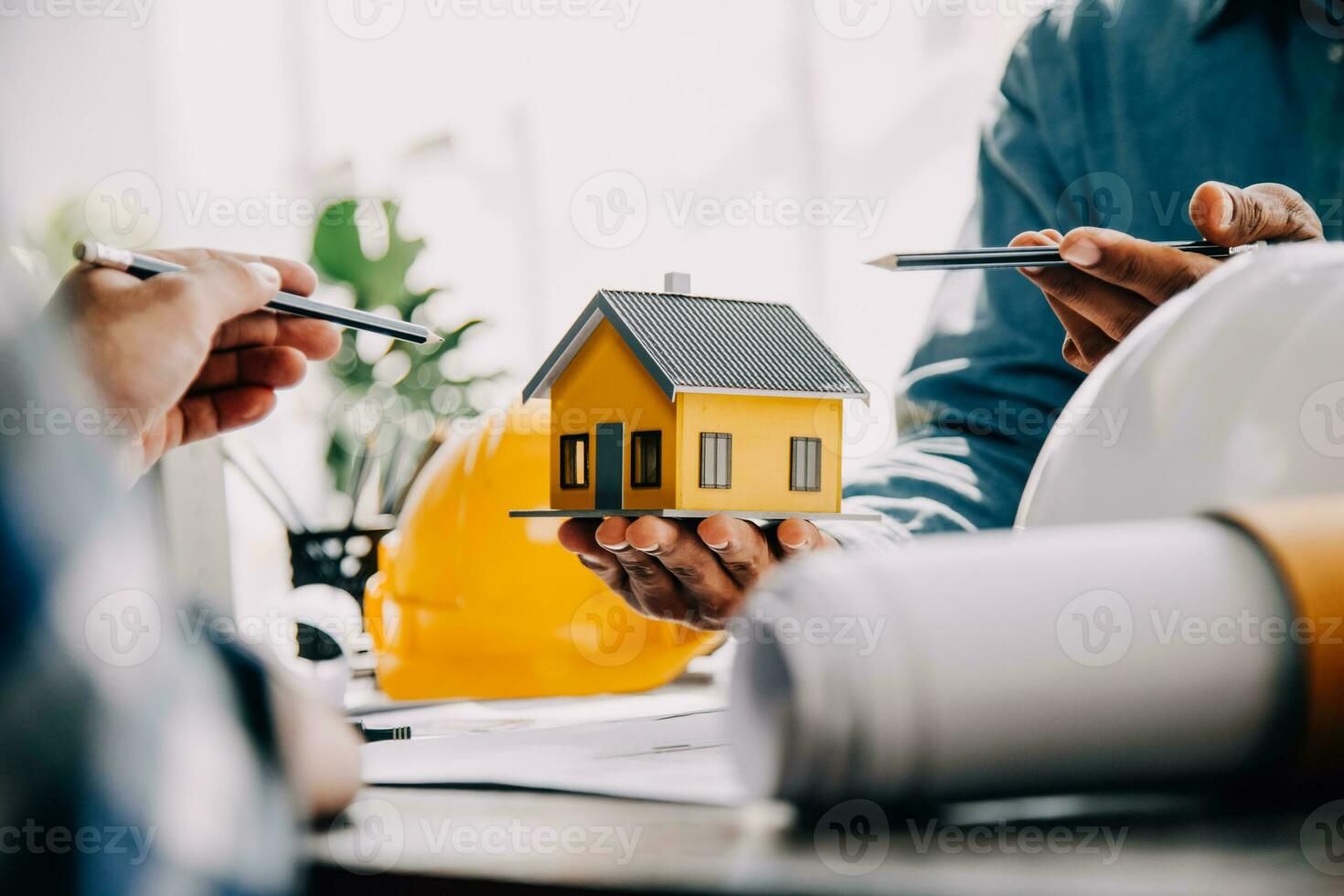Construction and structure concept of engineer working drawing on blueprint meeting for project working with partner on model building and engineering tools in working site, construction concept. photo