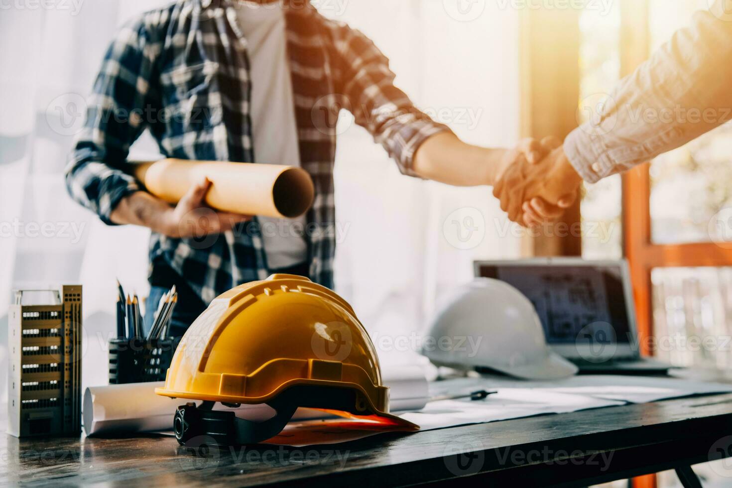 Construction and structure concept of engineer working drawing on blueprint meeting for project working with partner on model building and engineering tools in working site, construction concept. photo