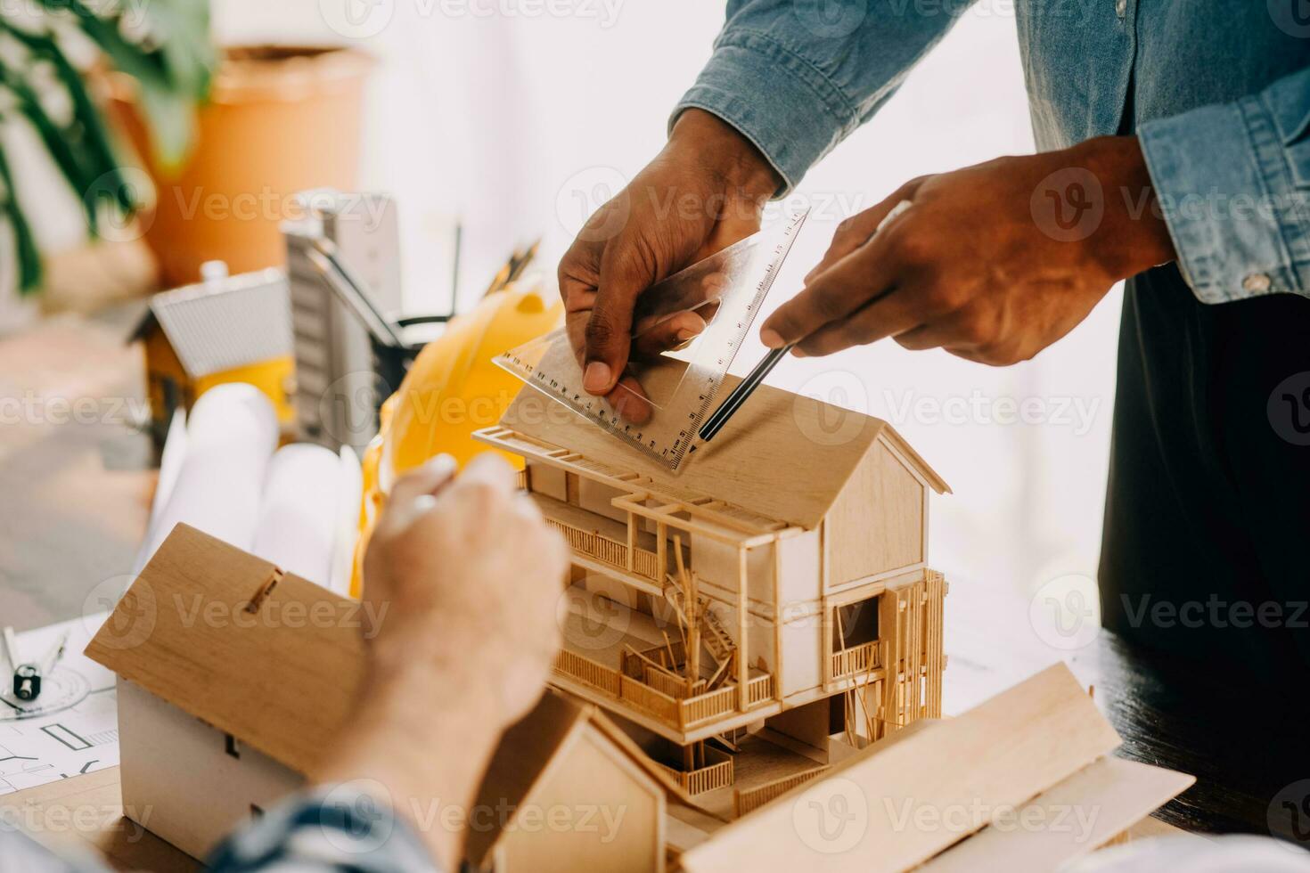 Construction and structure concept of engineer working drawing on blueprint meeting for project working with partner on model building and engineering tools in working site, construction concept. photo