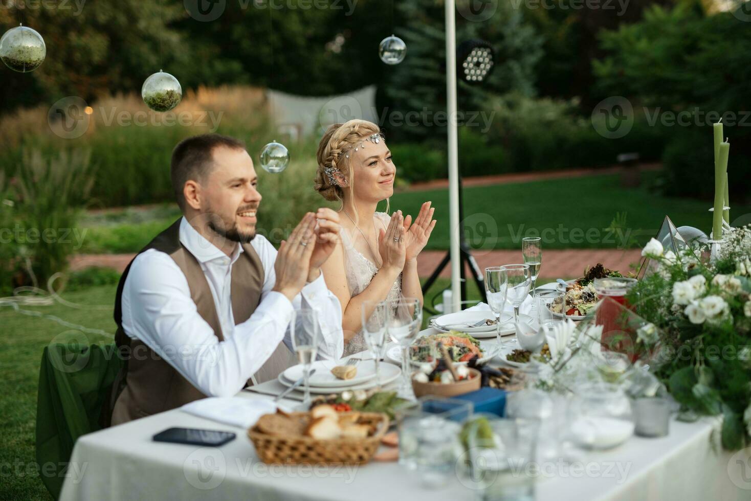 evening wedding family dinner in the forest photo