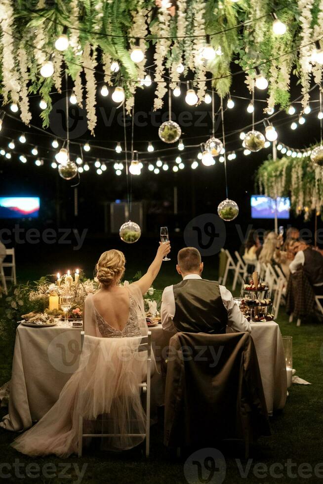 evening wedding family dinner in the forest photo