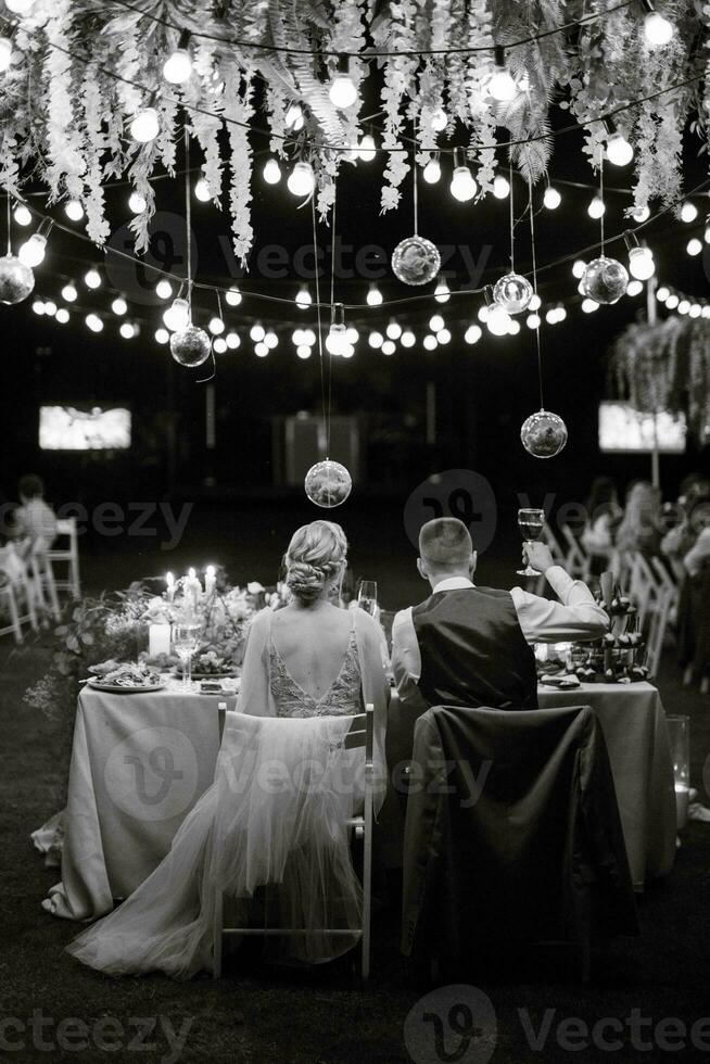 evening wedding family dinner in the forest photo