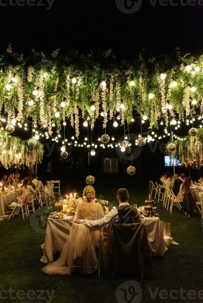 evening wedding family dinner in the forest photo