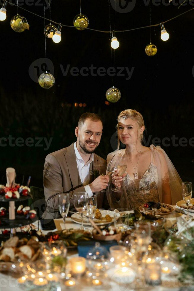 evening wedding family dinner in the forest photo