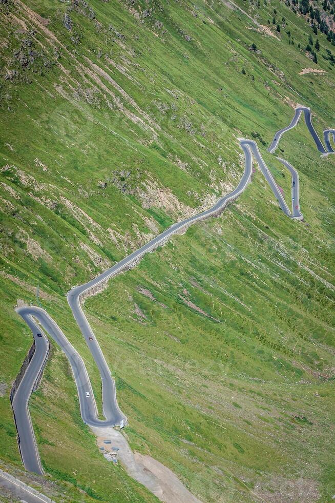 serpentine mountain road in Italian Alps, Stelvio pass, Passo dello Stelvio, Stelvio Natural Park photo