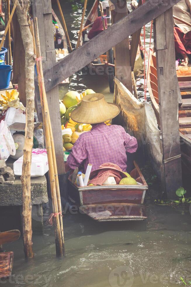 Traditional floating market in Damnoen Saduak near Bangkok photo