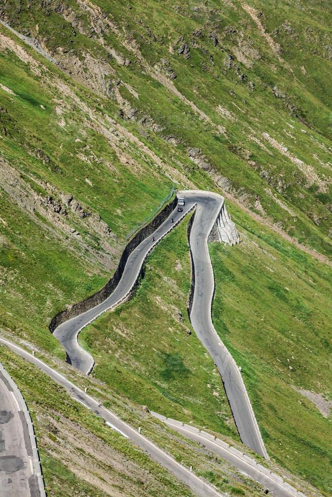 serpentine mountain road in Italian Alps, Stelvio pass, Passo dello Stelvio, Stelvio Natural Park photo