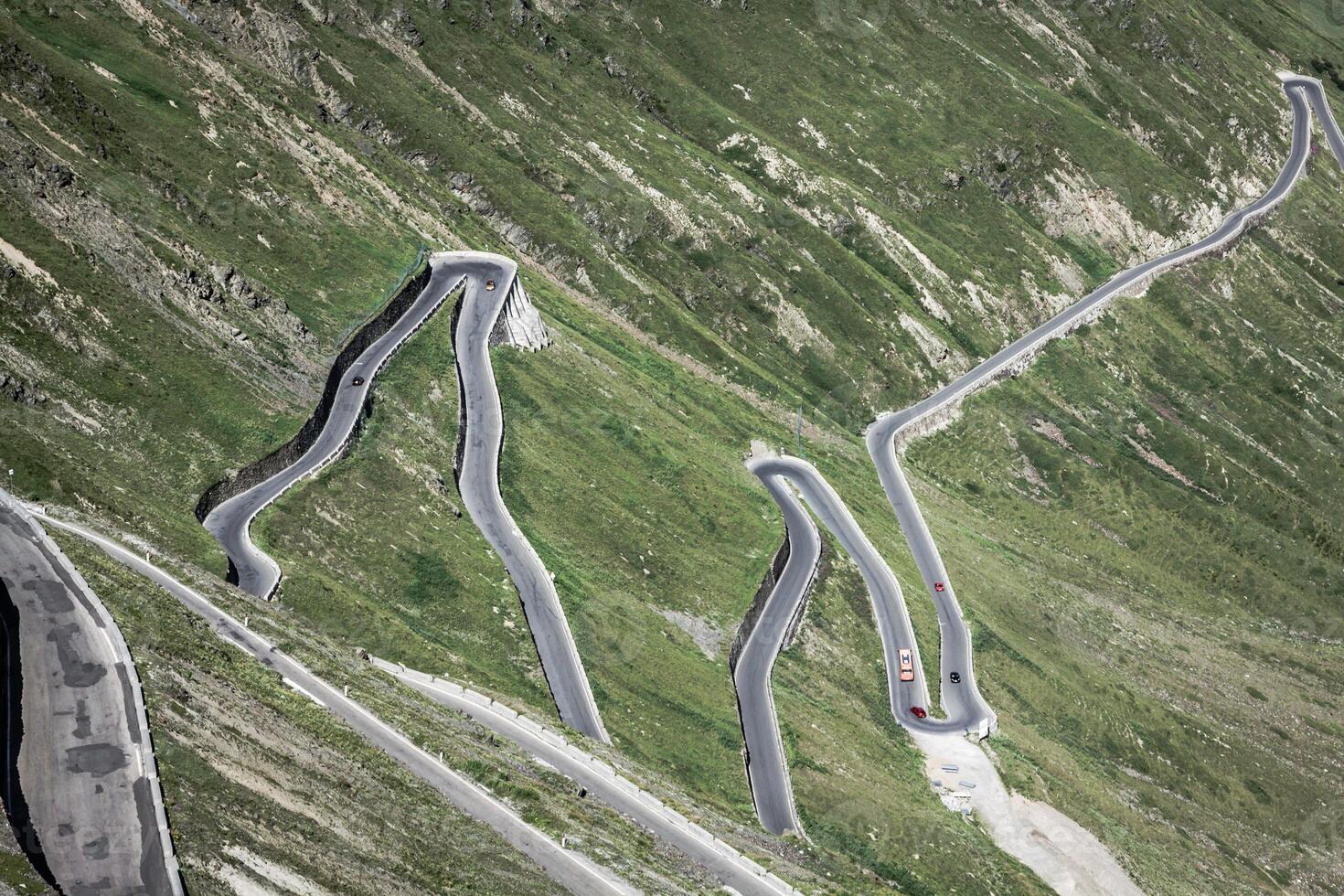 serpentine mountain road in Italian Alps, Stelvio pass, Passo dello Stelvio, Stelvio Natural Park photo