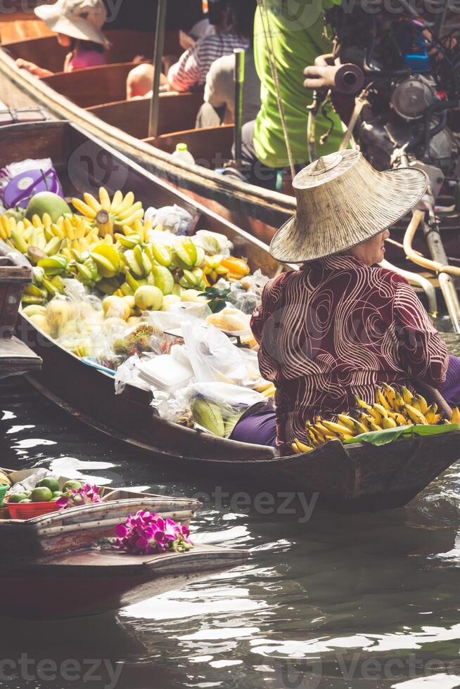 Traditional floating market in Damnoen Saduak near Bangkok photo