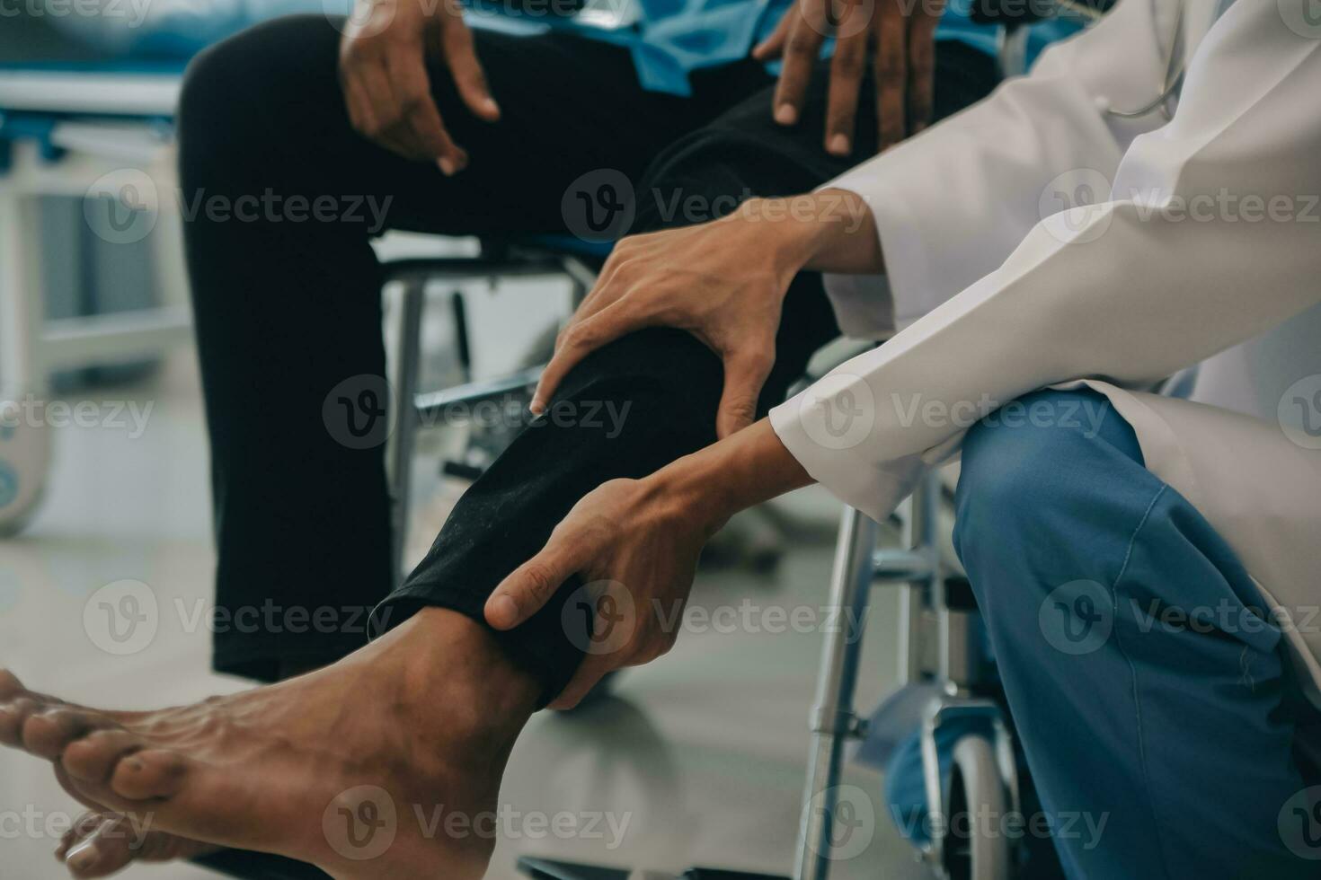 Doctor or Physiotherapist working examining treating injured arm of athlete male patient, stretching and exercise, Doing the Rehabilitation therapy pain in clinic. photo