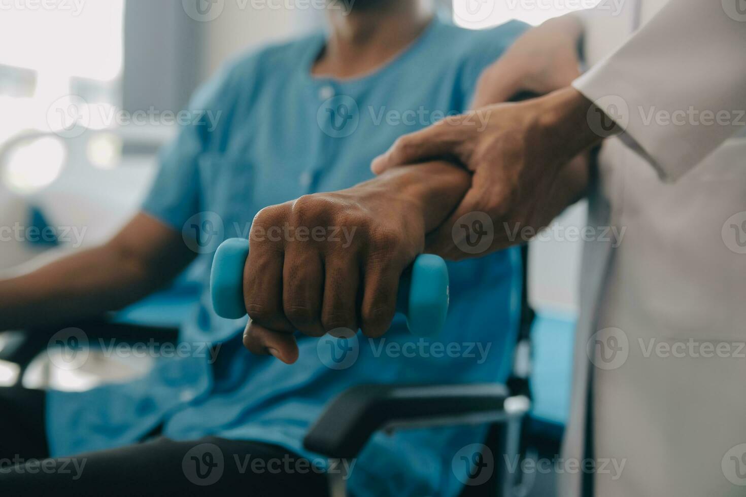 Doctor or Physiotherapist working examining treating injured arm of athlete male patient, stretching and exercise, Doing the Rehabilitation therapy pain in clinic. photo