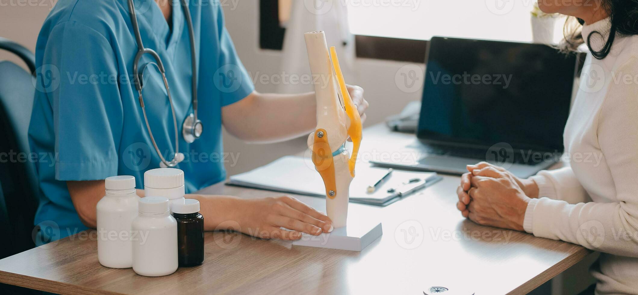Asian doctor woman visited patient woman to diagnosis and check up health at home or private hospital. Female patient explain health problem and symptoms to doctor .Health care premium service at home photo