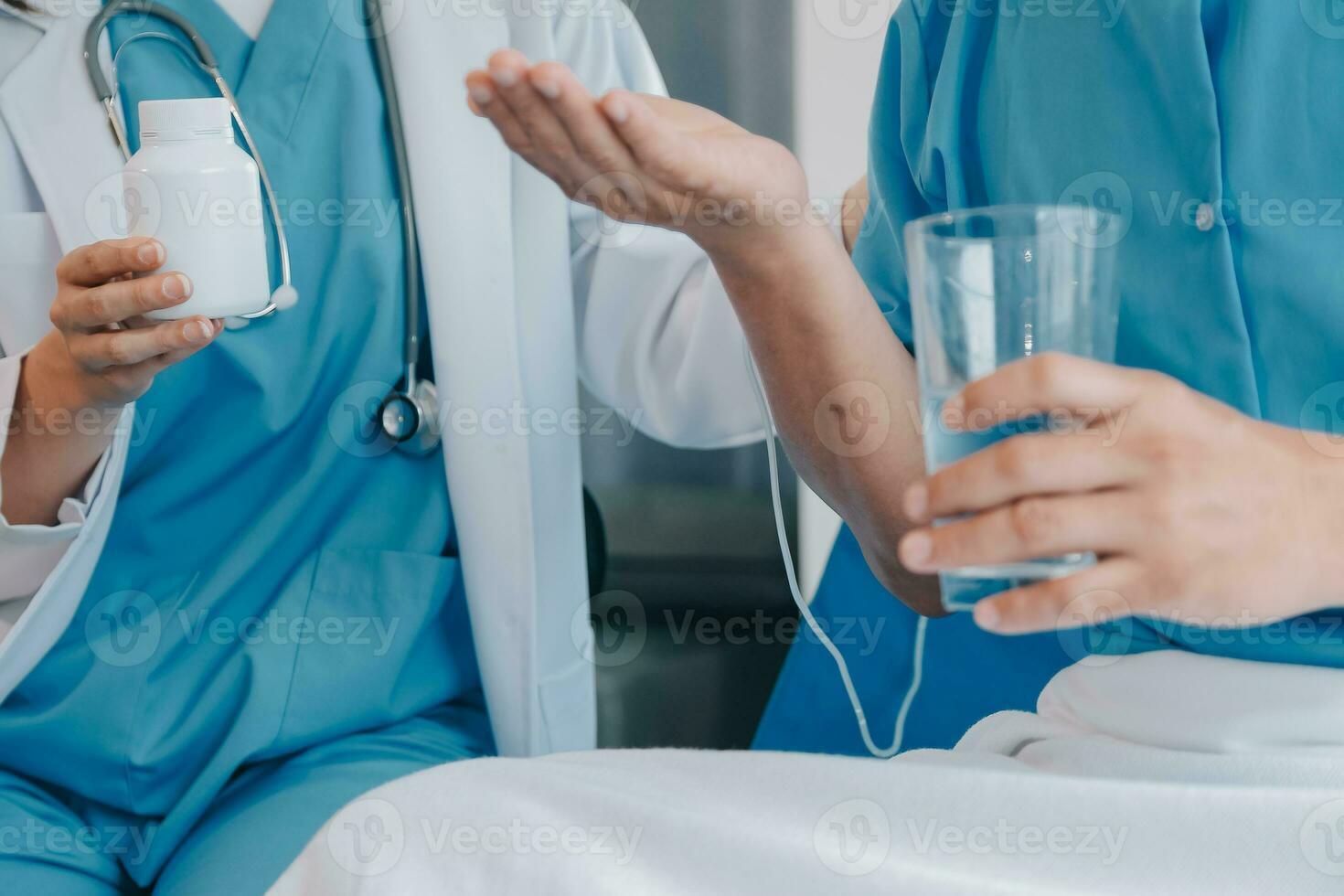 Injured patient showing doctor broken wrist and arm with bandage in hospital office or emergency room. Sprain, stress fracture or repetitive strain injury in hand. Nurse helping customer. First aid. photo