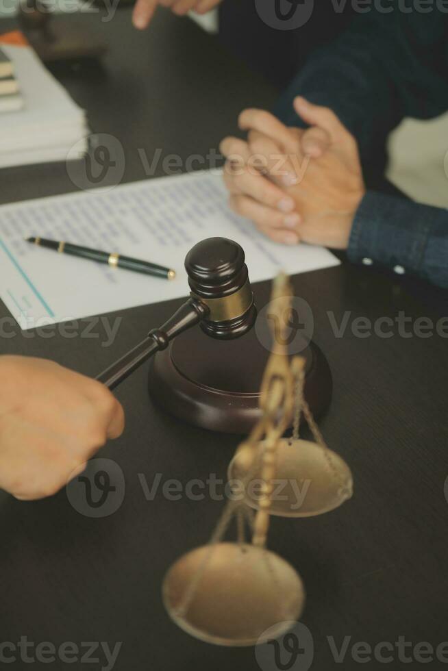 Lawyer, legal advisor, businessman brainstorming information on agreement details Business contracts in legal processing books for accuracy in contract documents. joint financial investment. photo