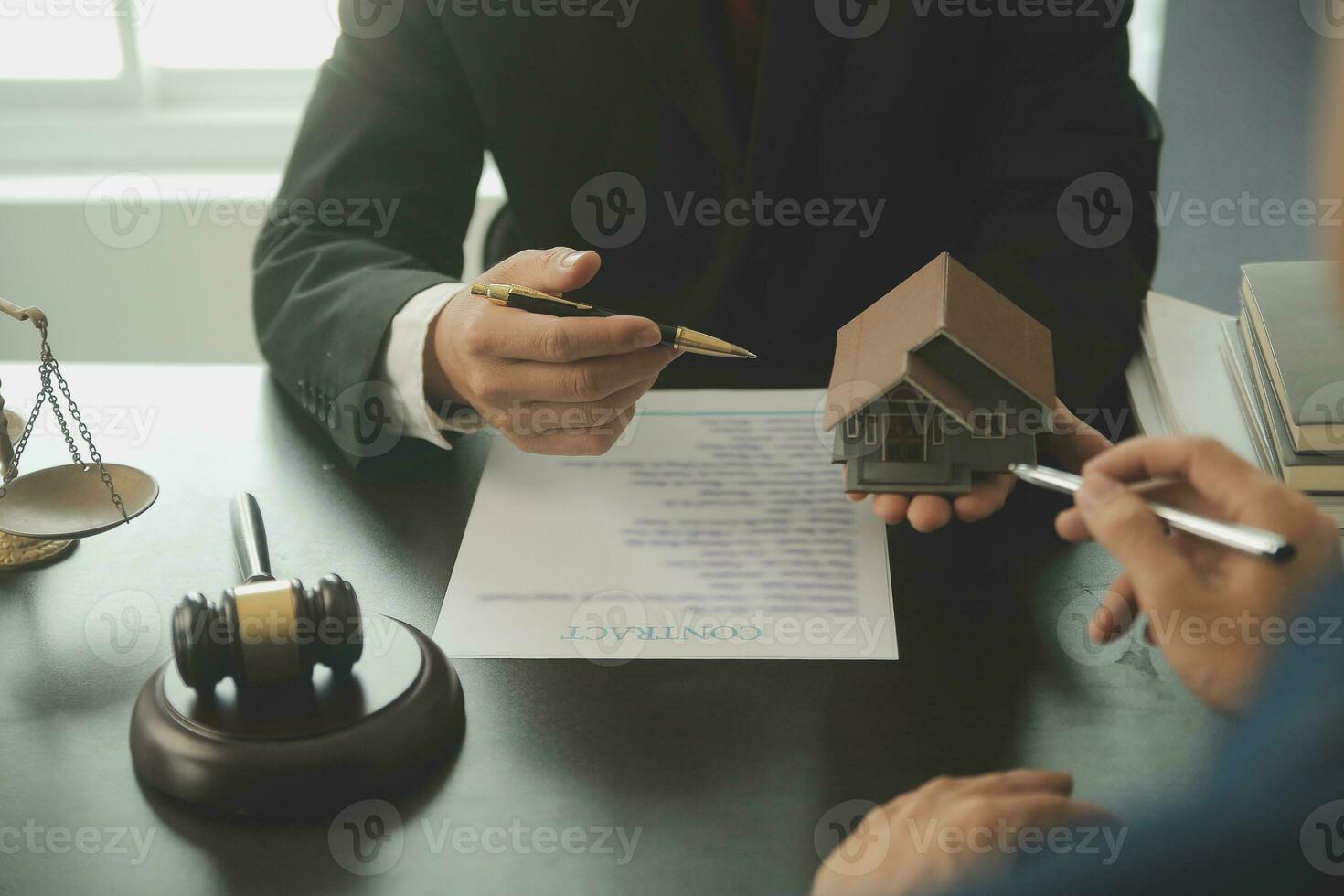 Lawyer, legal advisor, businessman brainstorming information on agreement details Business contracts in legal processing books for accuracy in contract documents. joint financial investment. photo