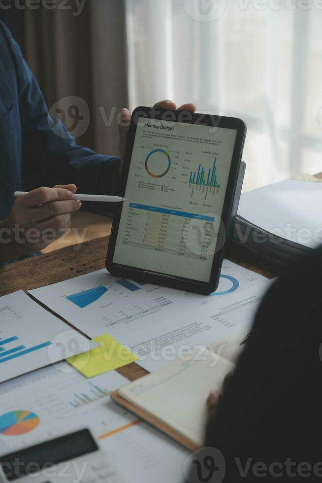 Team of business people working together in the meeting room office, teamwork background charts and graphs banner, double exposure successful teamwork,business planning concept. photo