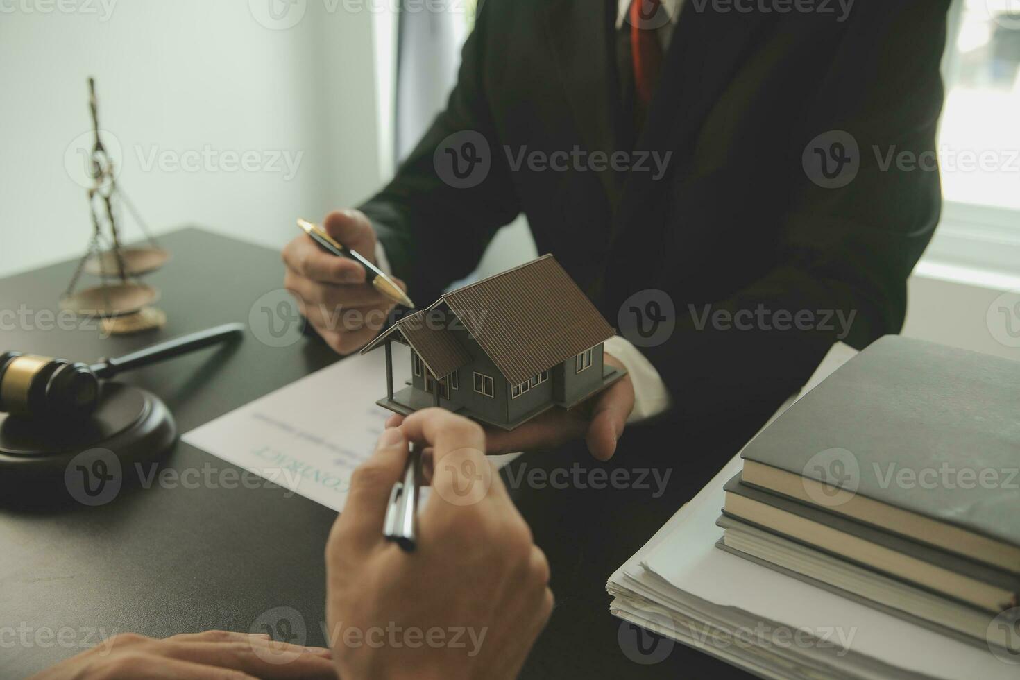 Lawyer, legal advisor, businessman brainstorming information on agreement details Business contracts in legal processing books for accuracy in contract documents. joint financial investment. photo