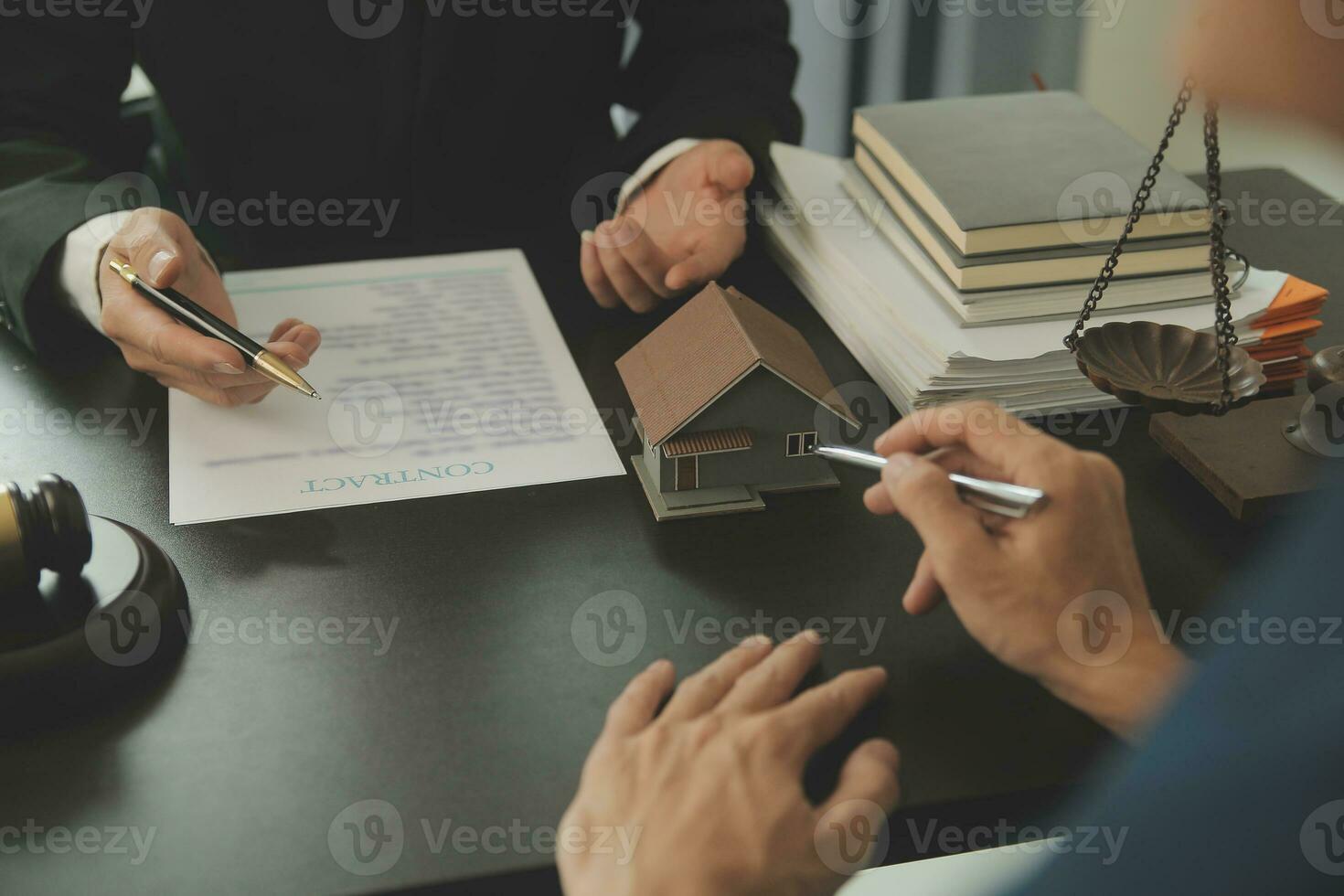 Lawyer, legal advisor, businessman brainstorming information on agreement details Business contracts in legal processing books for accuracy in contract documents. joint financial investment. photo