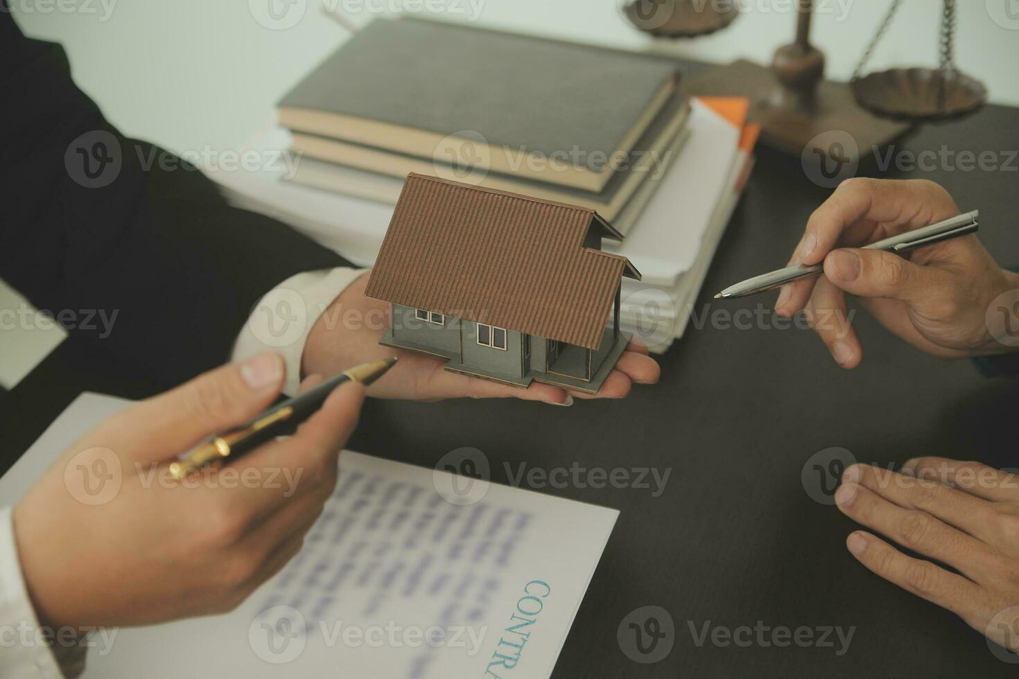 Lawyer, legal advisor, businessman brainstorming information on agreement details Business contracts in legal processing books for accuracy in contract documents. joint financial investment. photo