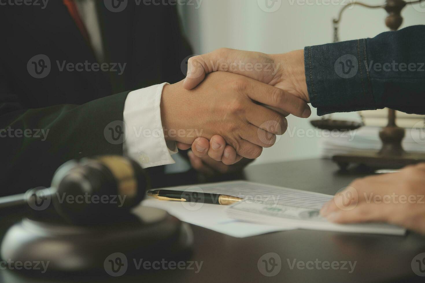 Lawyer, legal advisor, businessman brainstorming information on agreement details Business contracts in legal processing books for accuracy in contract documents. joint financial investment. photo