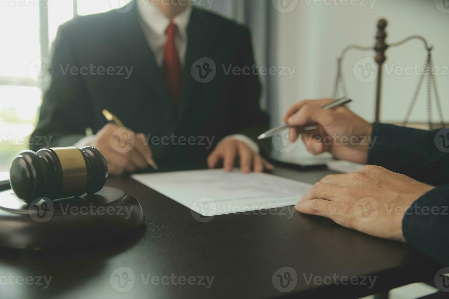 Lawyer, legal advisor, businessman brainstorming information on agreement details Business contracts in legal processing books for accuracy in contract documents. joint financial investment. photo