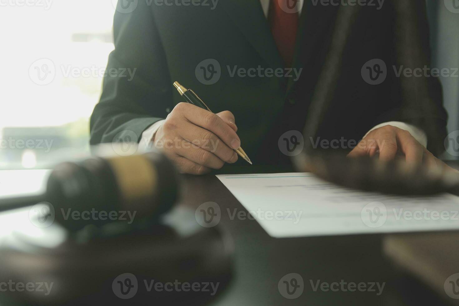Lawyer, legal advisor, businessman brainstorming information on agreement details Business contracts in legal processing books for accuracy in contract documents. joint financial investment. photo