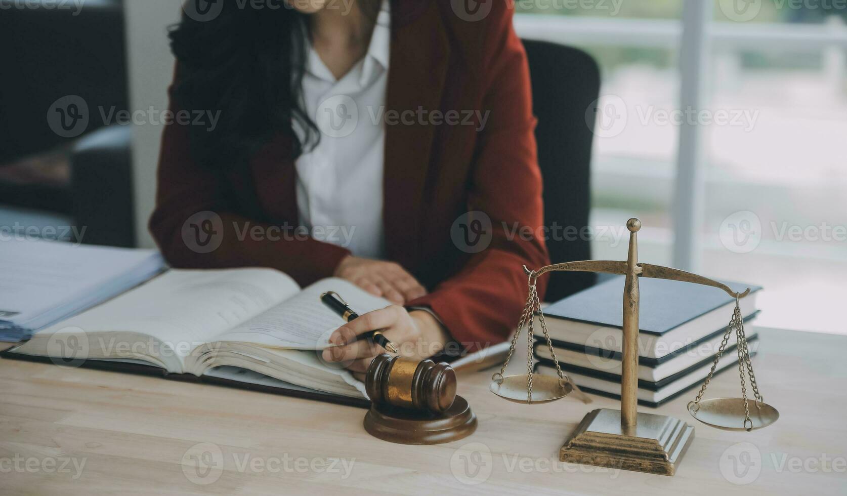 Business and lawyers discussing contract papers with brass scale on desk in office. Law, legal services, advice, justice and law concept picture with film grain effect photo