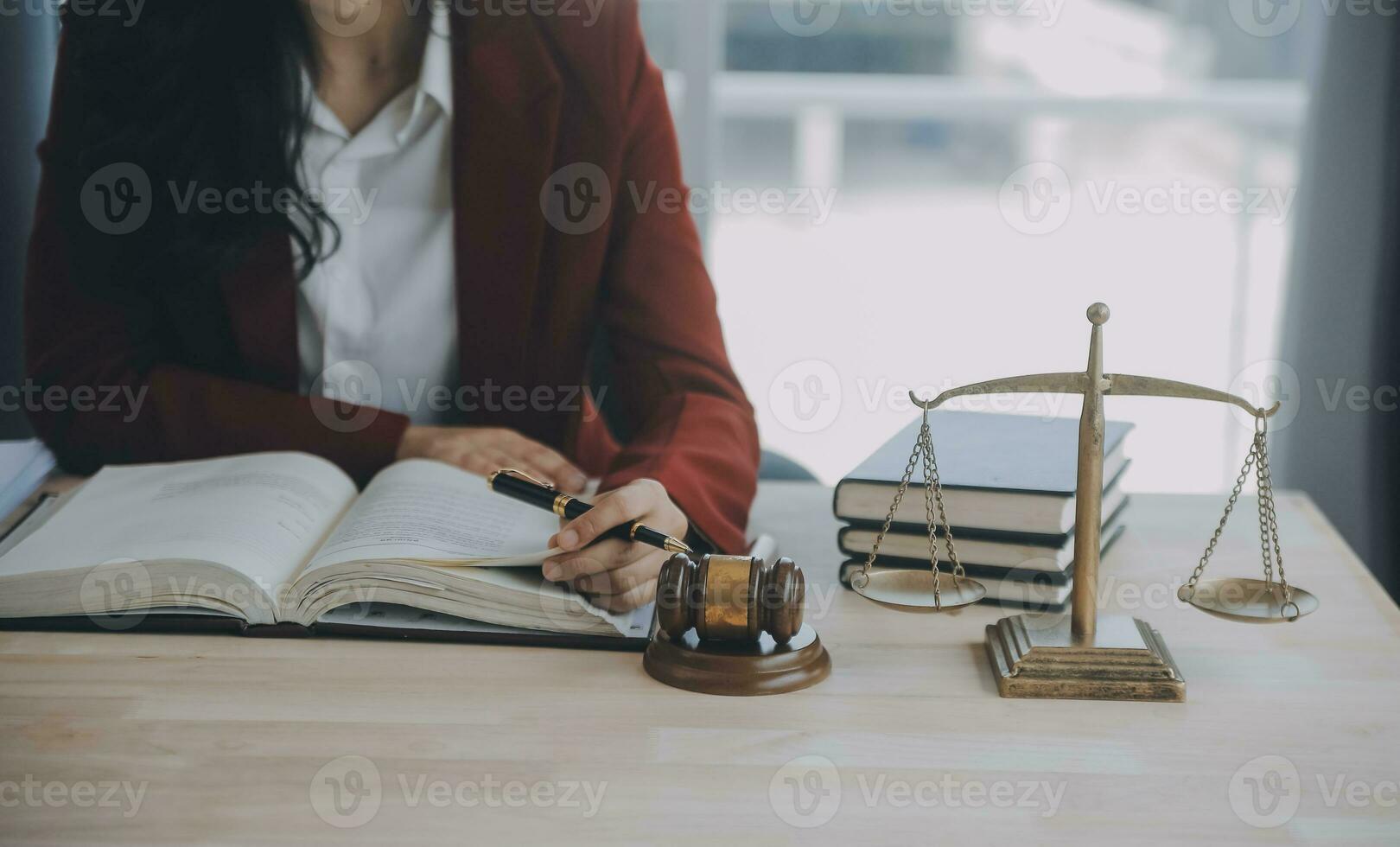 Business and lawyers discussing contract papers with brass scale on desk in office. Law, legal services, advice, justice and law concept picture with film grain effect photo
