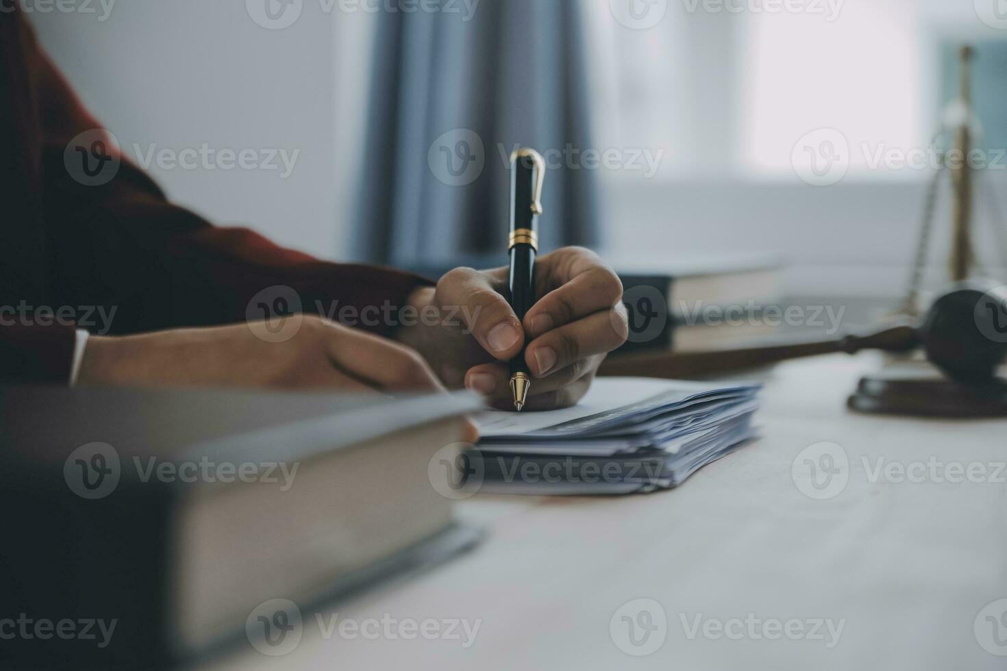 Business and lawyers discussing contract papers with brass scale on desk in office. Law, legal services, advice, justice and law concept picture with film grain effect photo