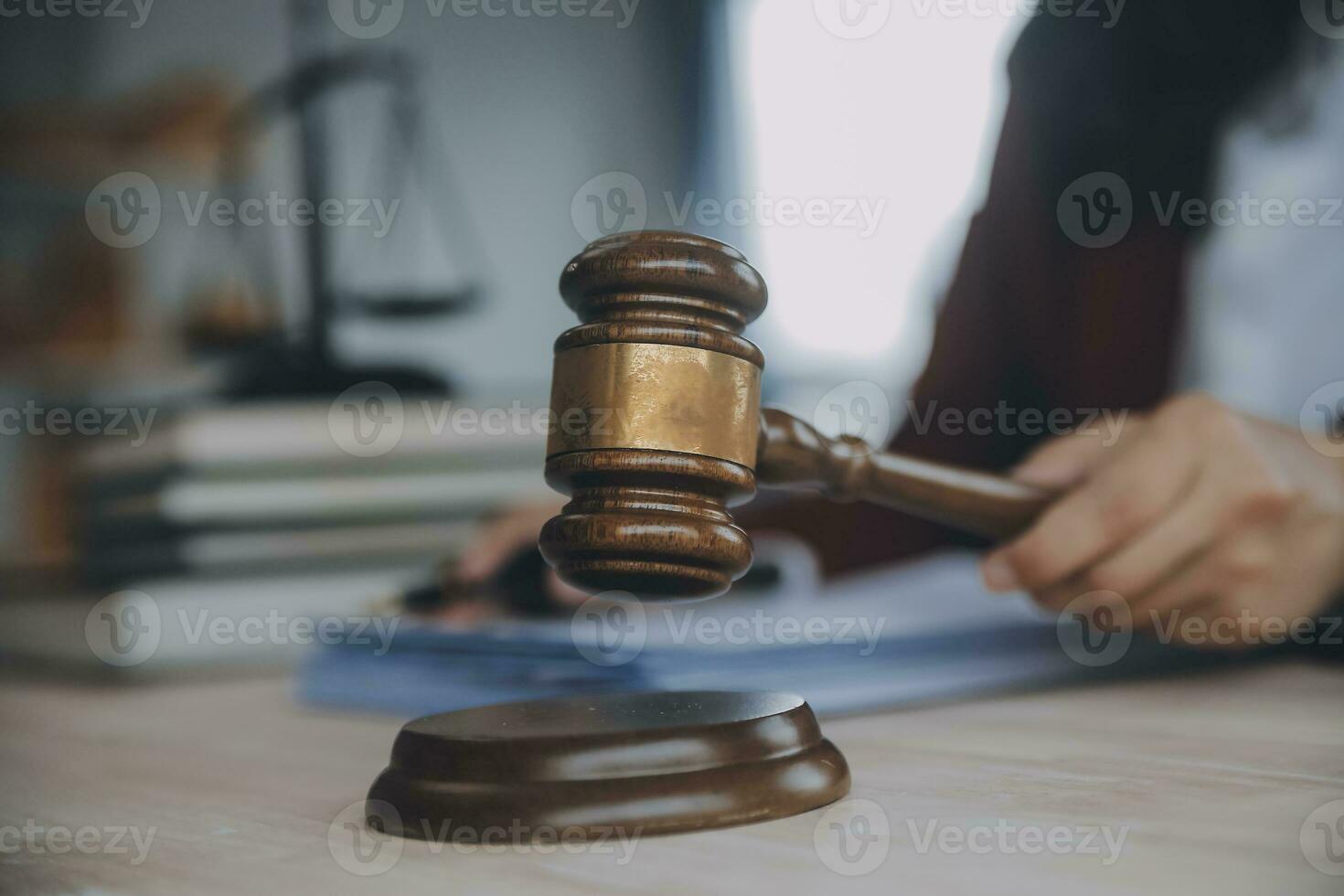 Business and lawyers discussing contract papers with brass scale on desk in office. Law, legal services, advice, justice and law concept picture with film grain effect photo