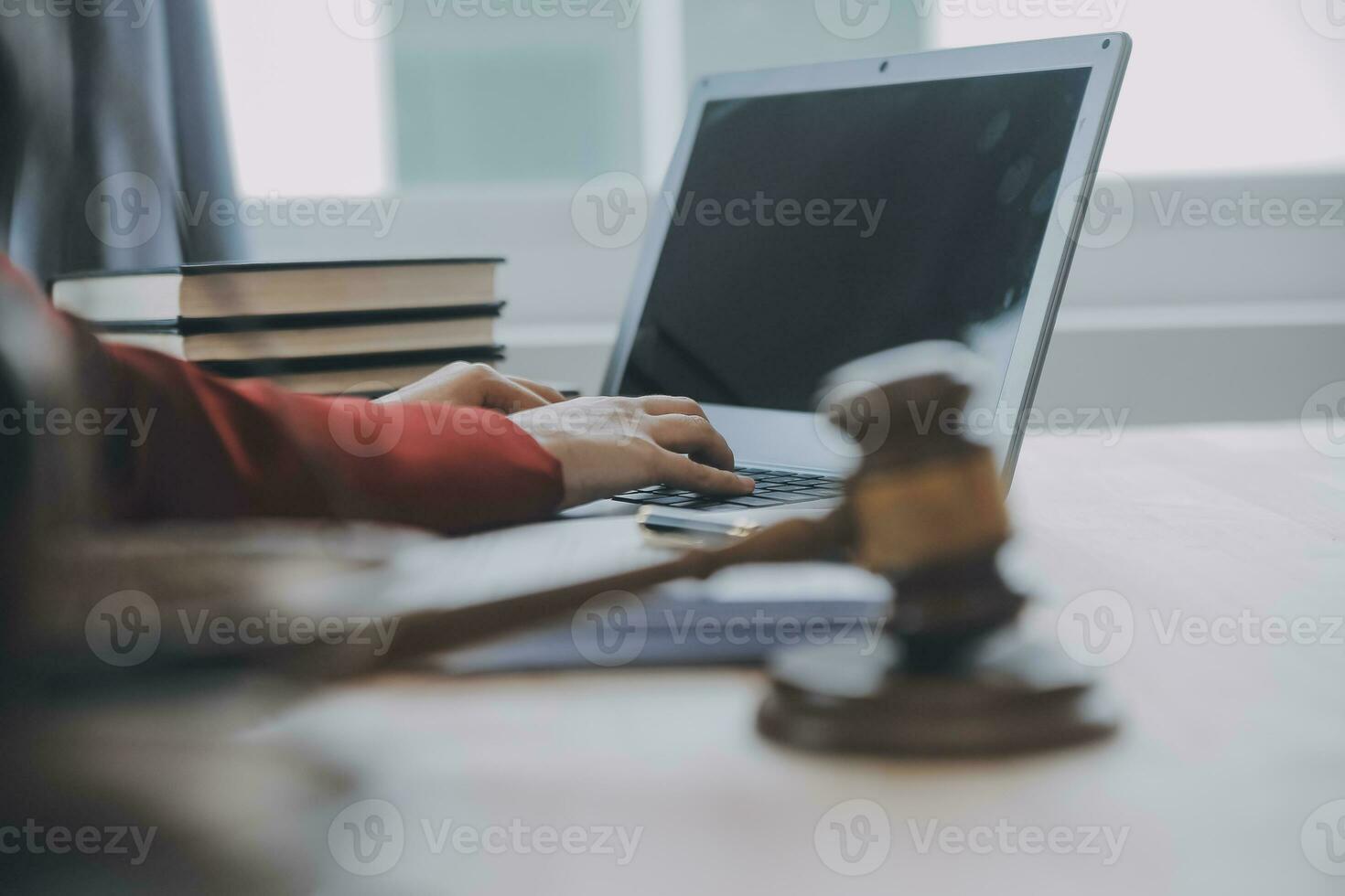 Business and lawyers discussing contract papers with brass scale on desk in office. Law, legal services, advice, justice and law concept picture with film grain effect photo