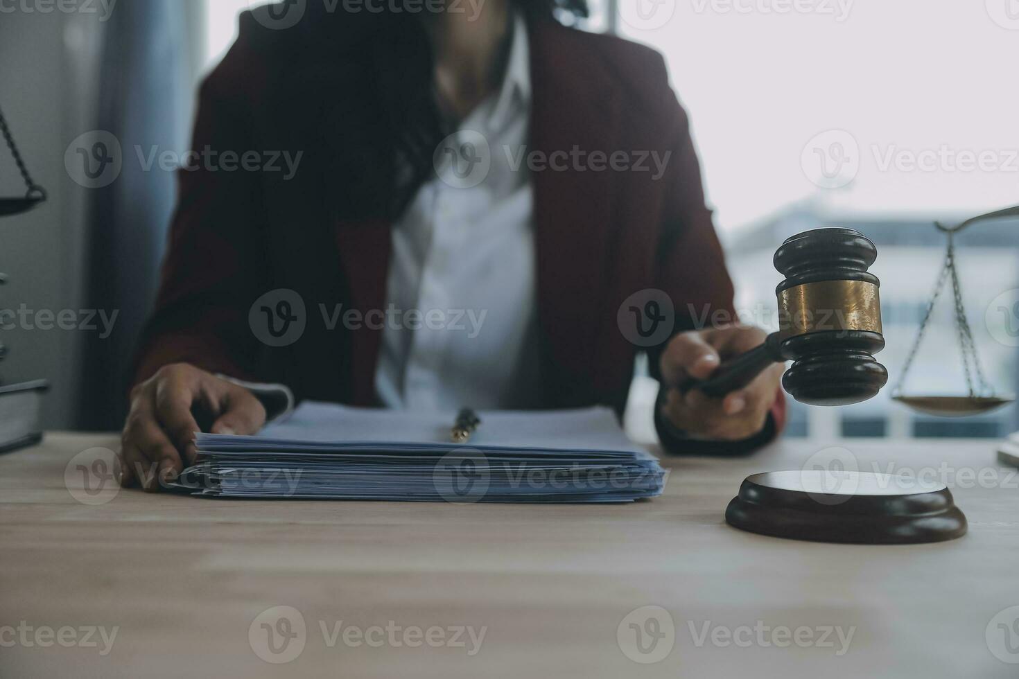 Business and lawyers discussing contract papers with brass scale on desk in office. Law, legal services, advice, justice and law concept picture with film grain effect photo