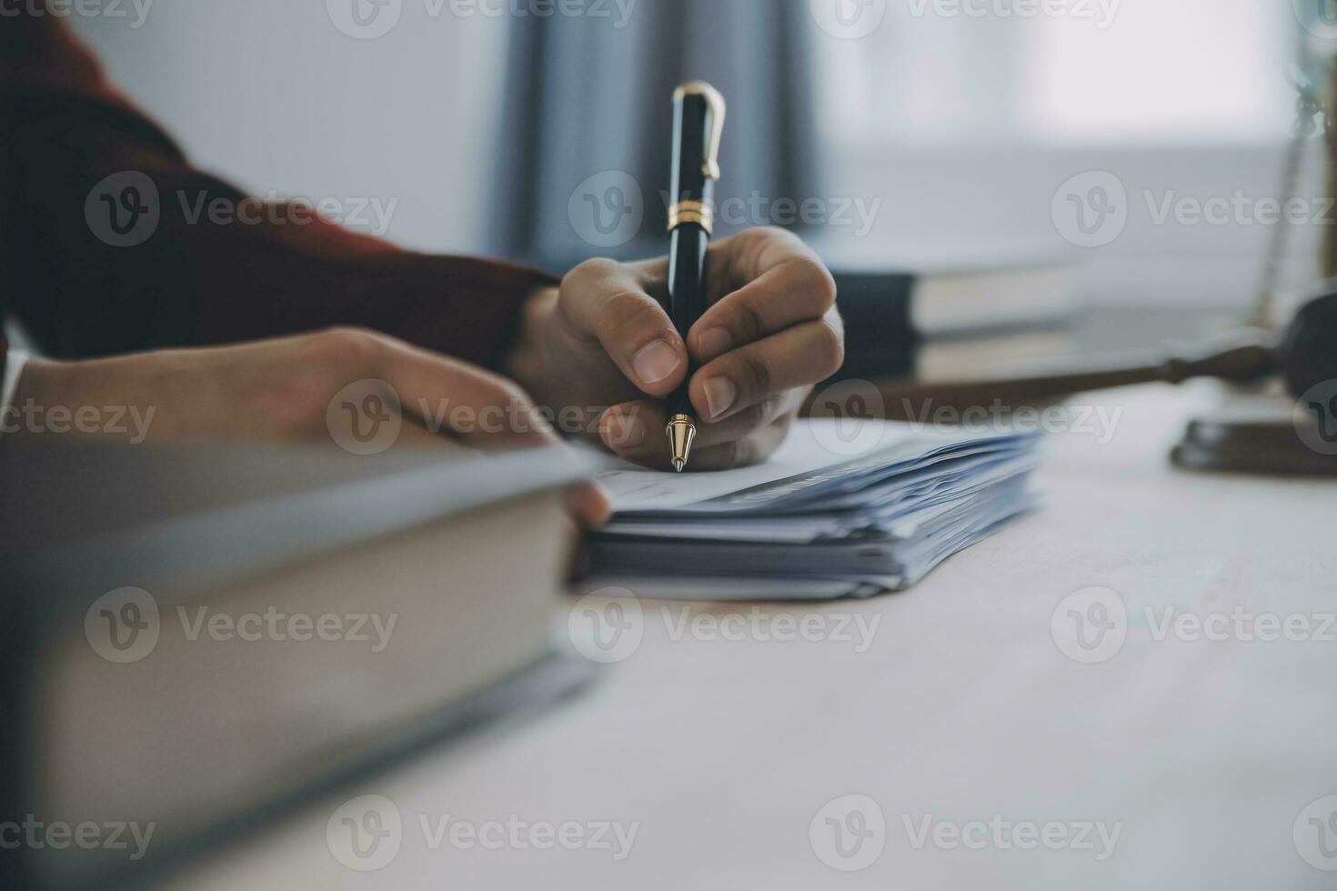 Business and lawyers discussing contract papers with brass scale on desk in office. Law, legal services, advice, justice and law concept picture with film grain effect photo