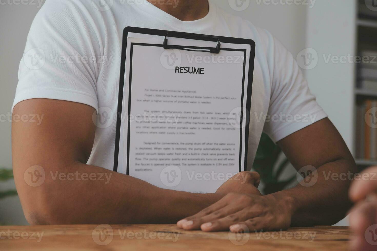 Close up view of job interview in office, focus on resume writing tips, employer reviewing good cv of prepared skilled applicant, recruiter considering application, hr manager making hiring decision photo