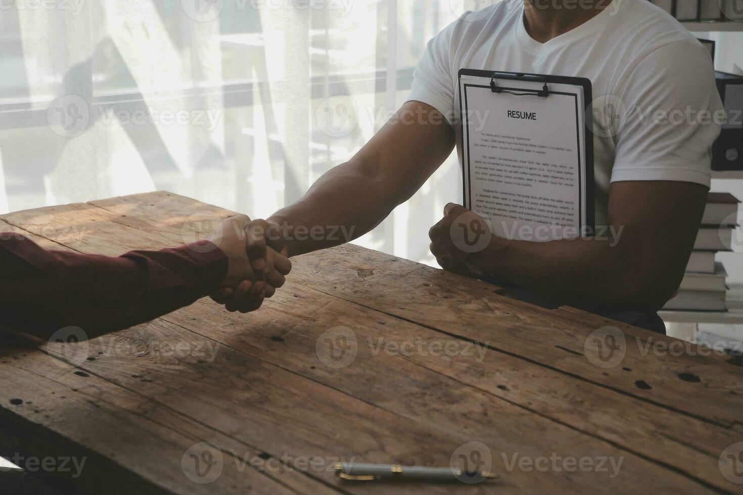 Close up view of job interview in office, focus on resume writing tips, employer reviewing good cv of prepared skilled applicant, recruiter considering application, hr manager making hiring decision photo