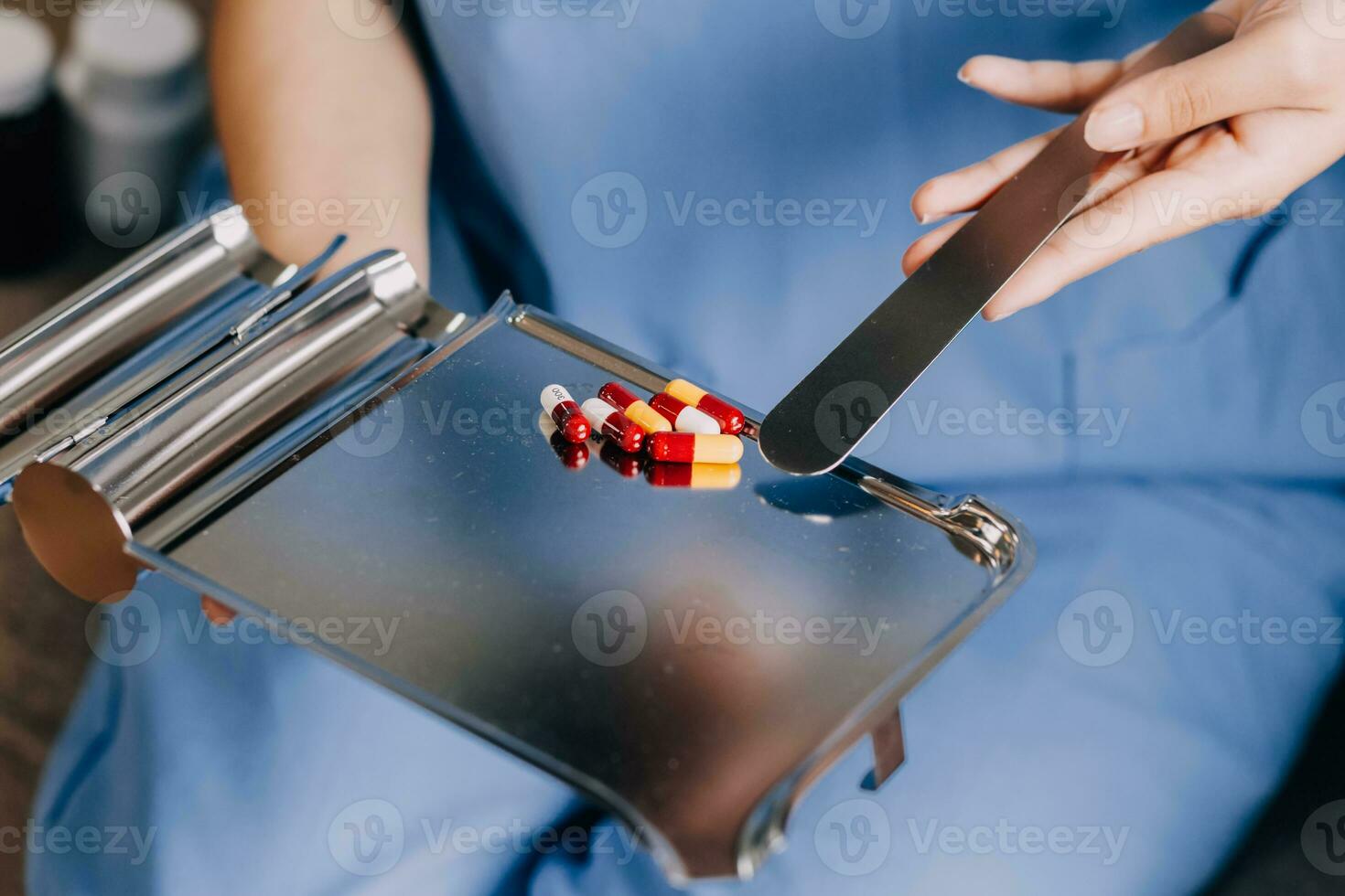 Doctor and patient sitting and talking at medical examination at hospital office, close-up. Therapist filling up medication history records. Medicine and healthcare concept. photo