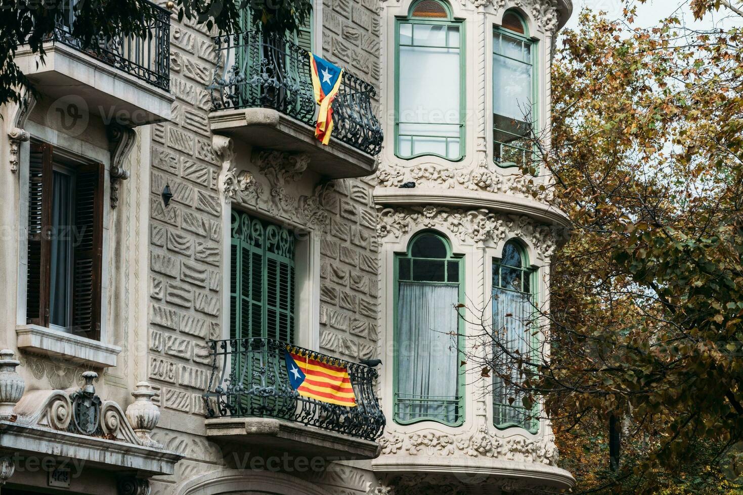 Independence flags hanging from balconies on a building in Barcelona, Catalonia, Spain photo