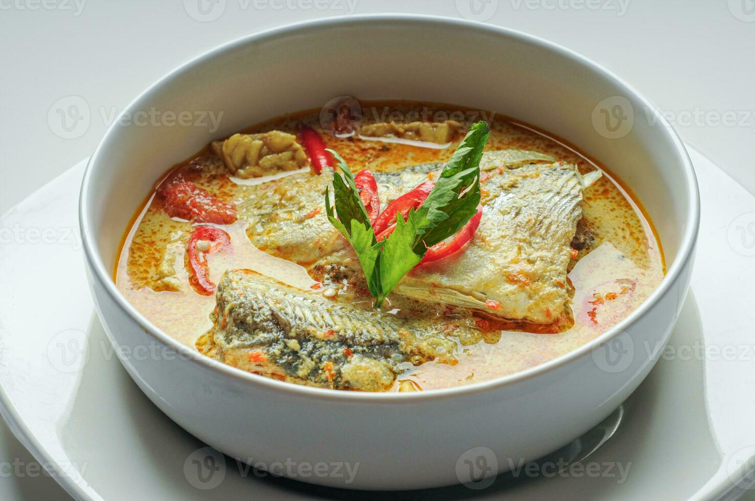 fish curry soup in a ready-to-eat bowl photo
