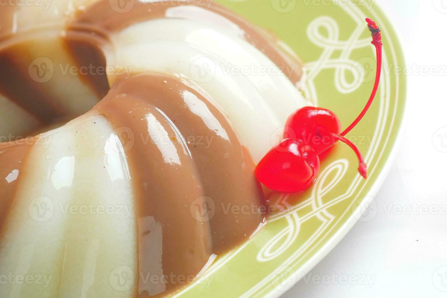 Jelly Pudding garnished with Cherry photo