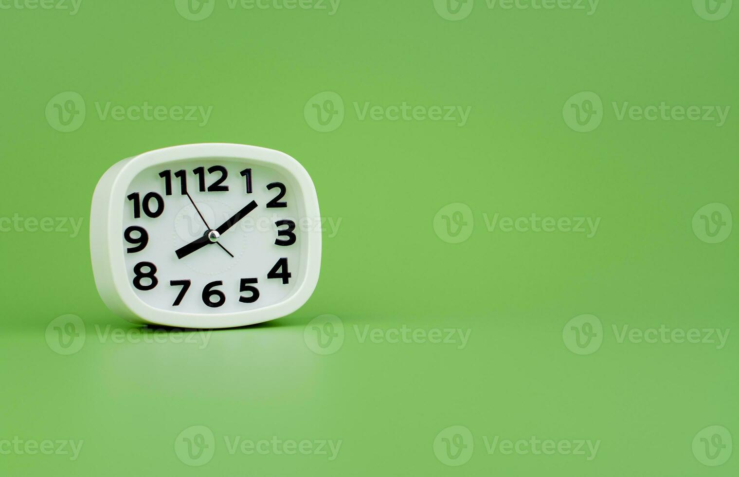 Modern alarm clock with clock hands standing still Working with time, being punctual, time is valuable to work and life. photo