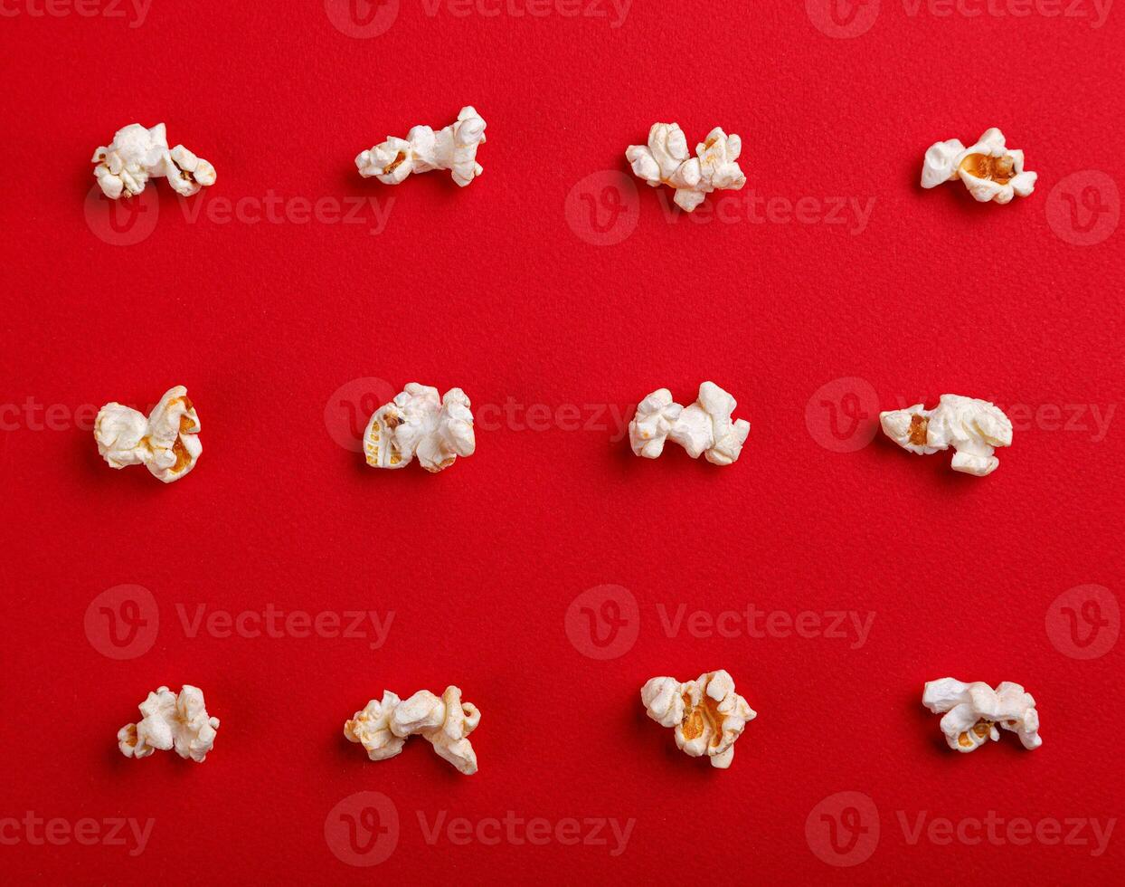 popcorn macro on a red background photo