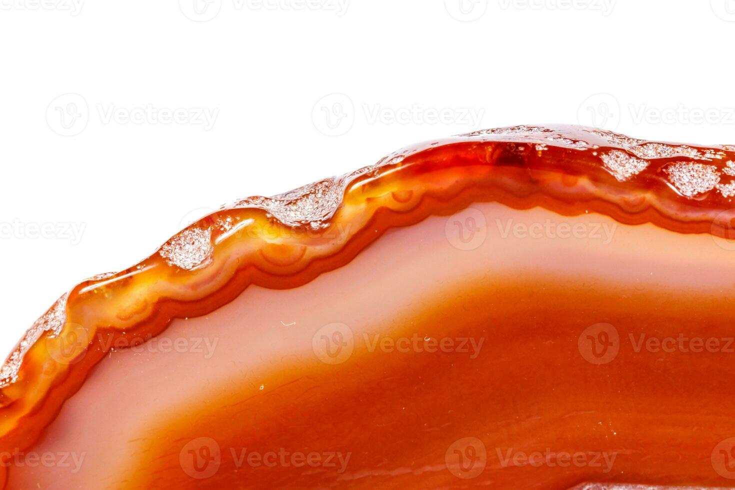 Macro mineral orange agate in crystals on white background photo