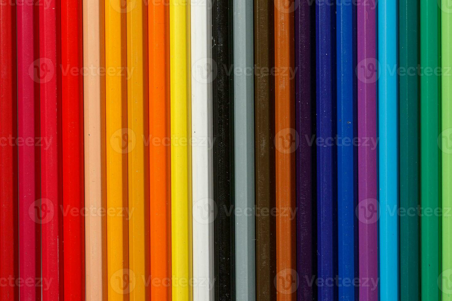 Multi-colored pencils in a row photo