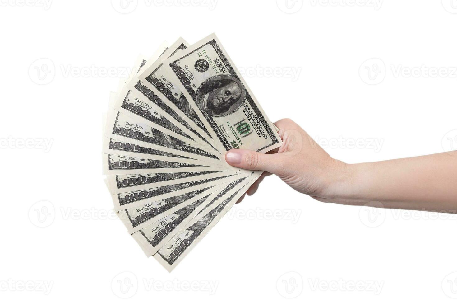 Hand on the right shows a fan of money. Money in a hand isolated on white background 100 dollars photo