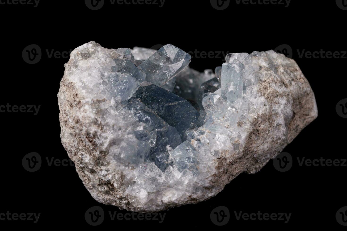 Celestine mineral stone macro on microcline on black background photo