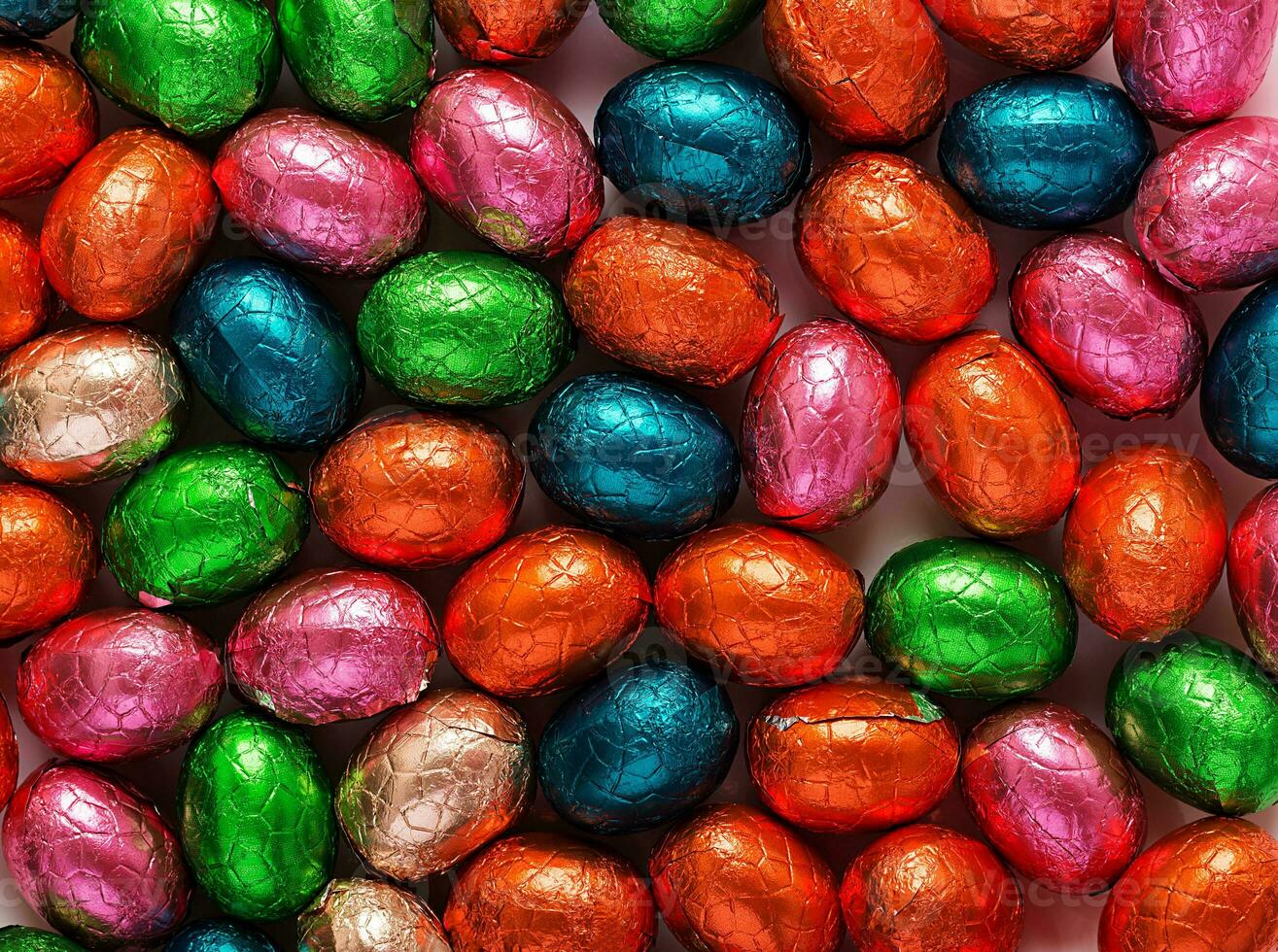 Colorful Easter eggs background. Chocolate Easter eggs texture. Top view photo